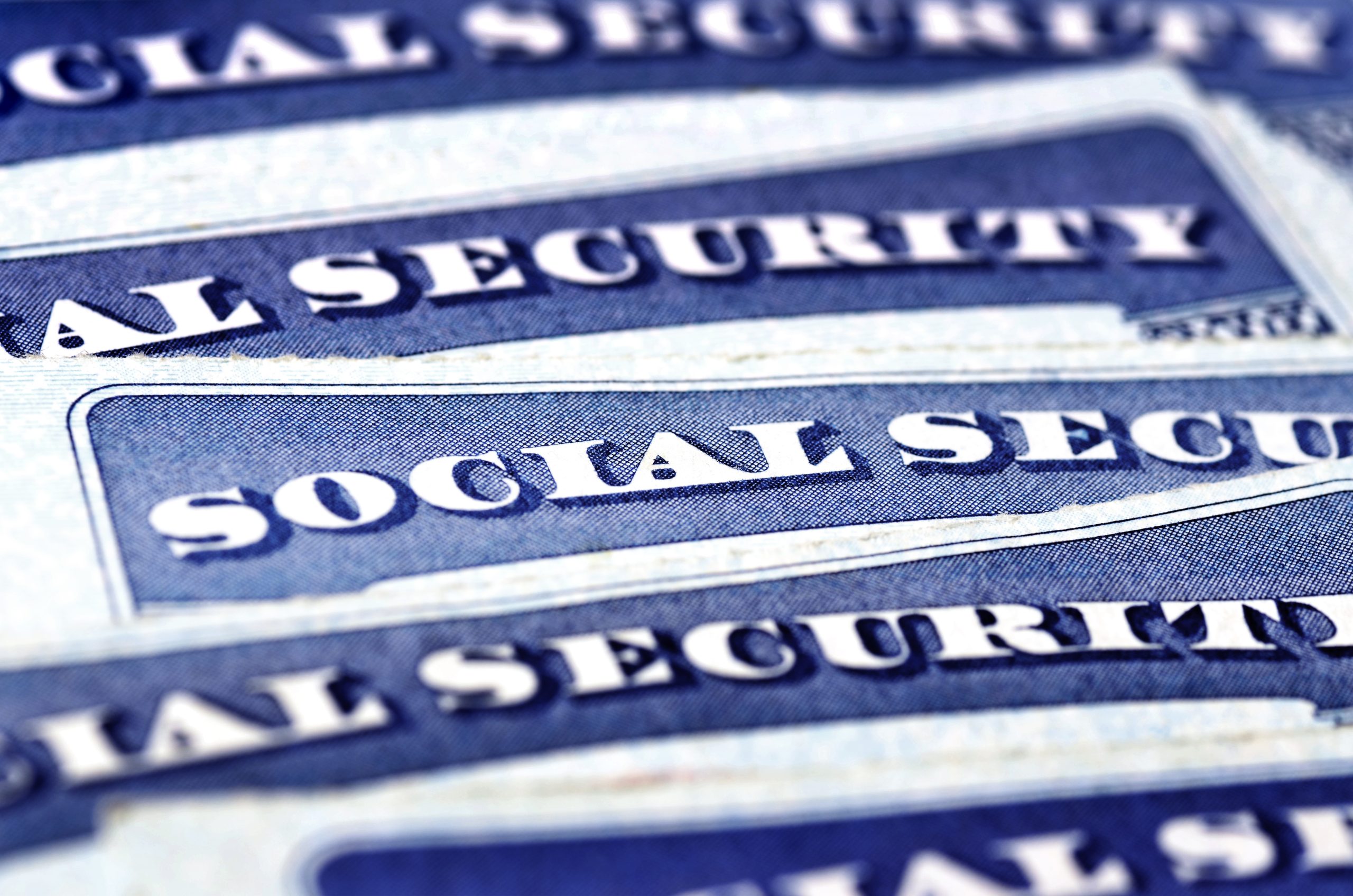 sheets of paper labeled 'Social Security' symbolizing crucial resources for disability benefits tailored for individuals managing severe mental illness, including access to the SOAR program